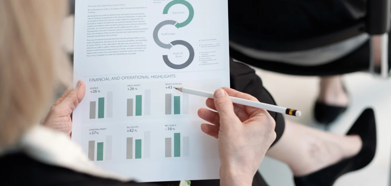 Hand of female analyst with a case study document