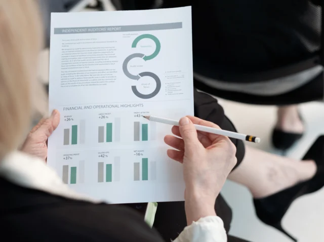 Hand of female analyst with a case study document